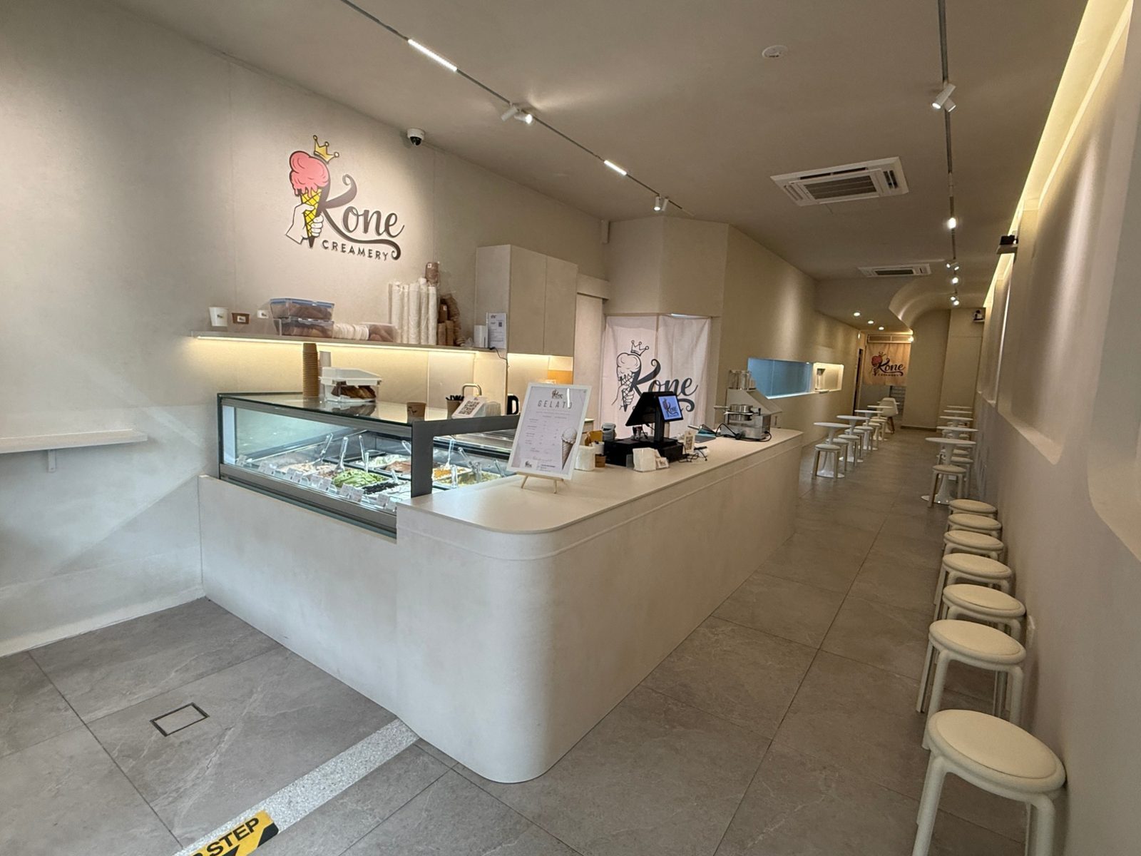 Gelato counter and seating inside Kone Creamery